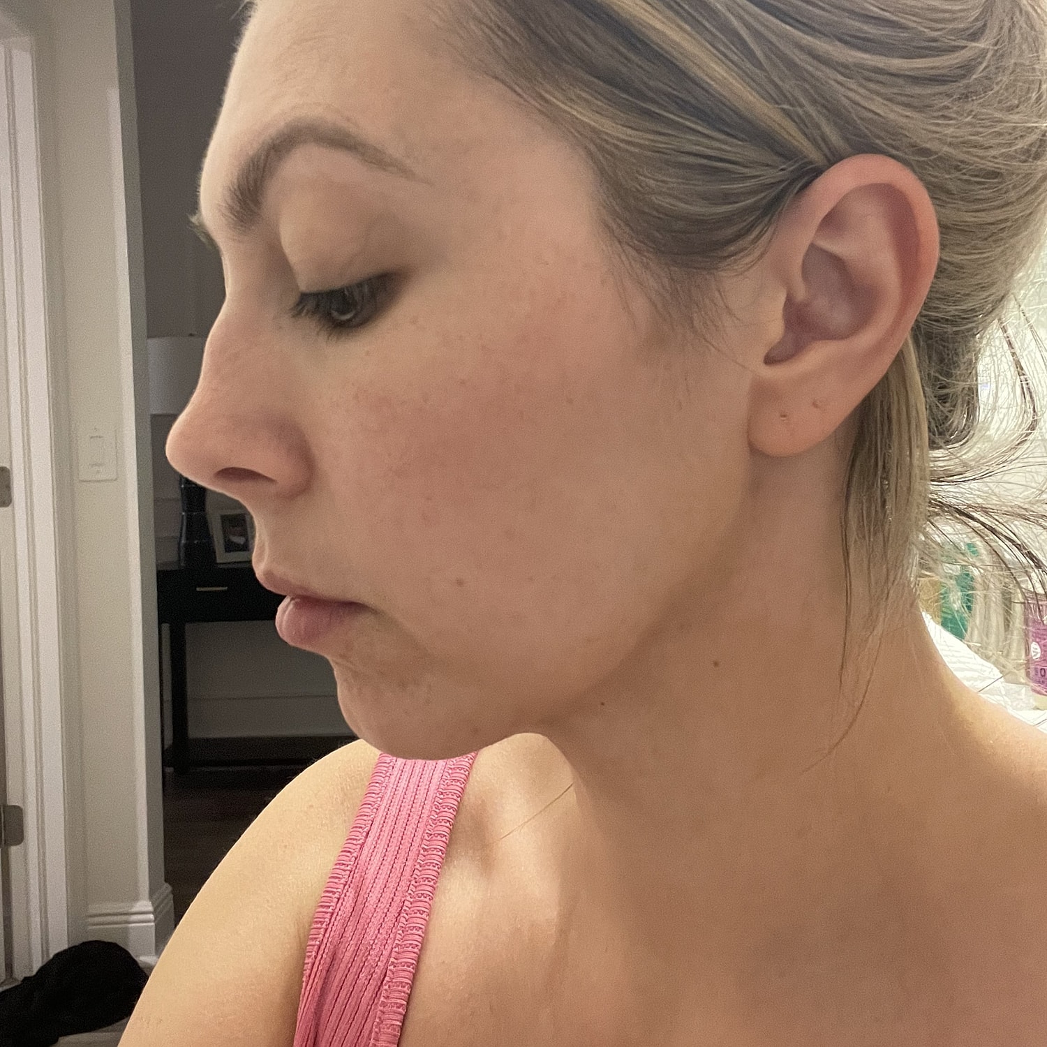 Profile view of a woman with makeup.