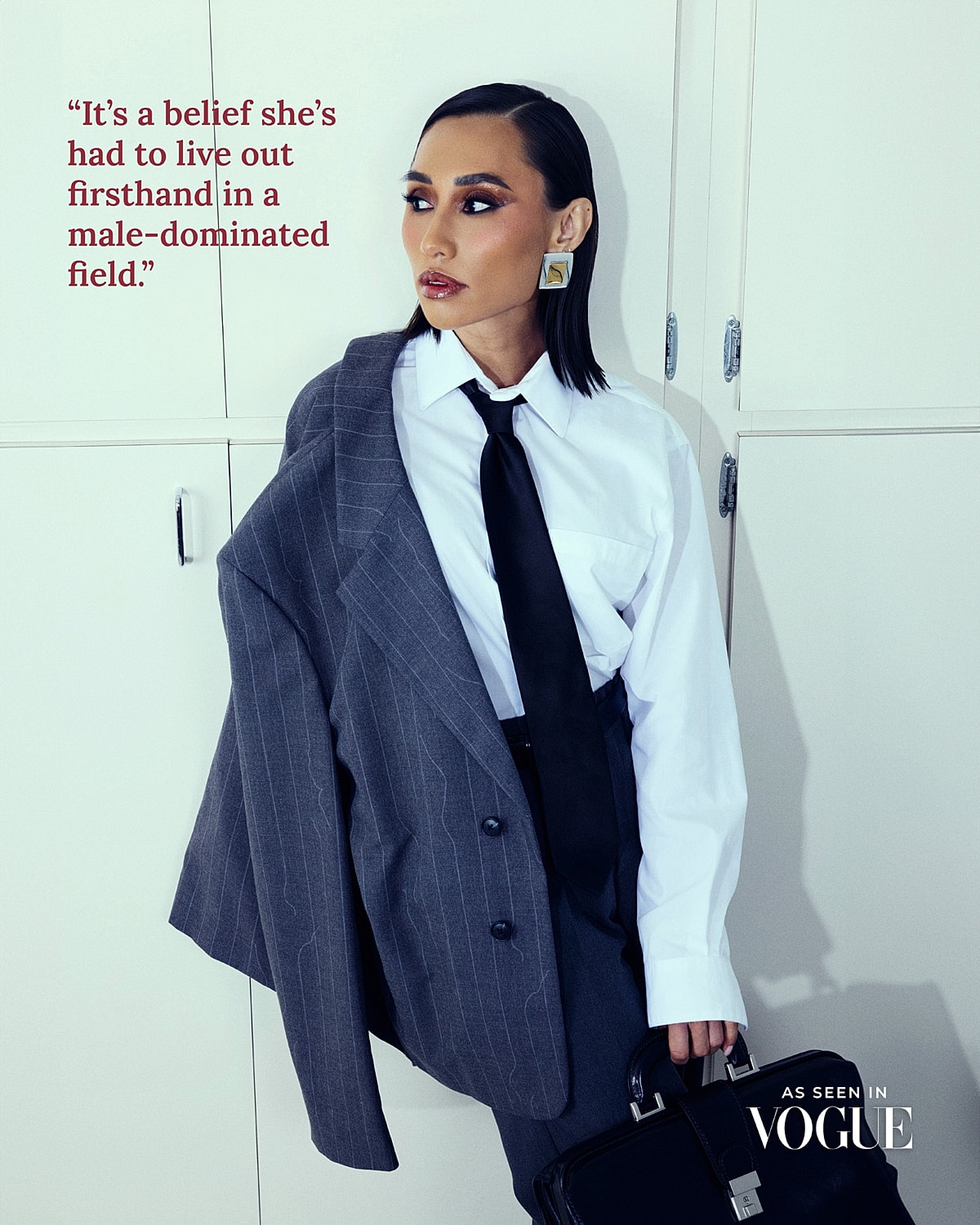 Confident woman in suit, challenging stereotypes.