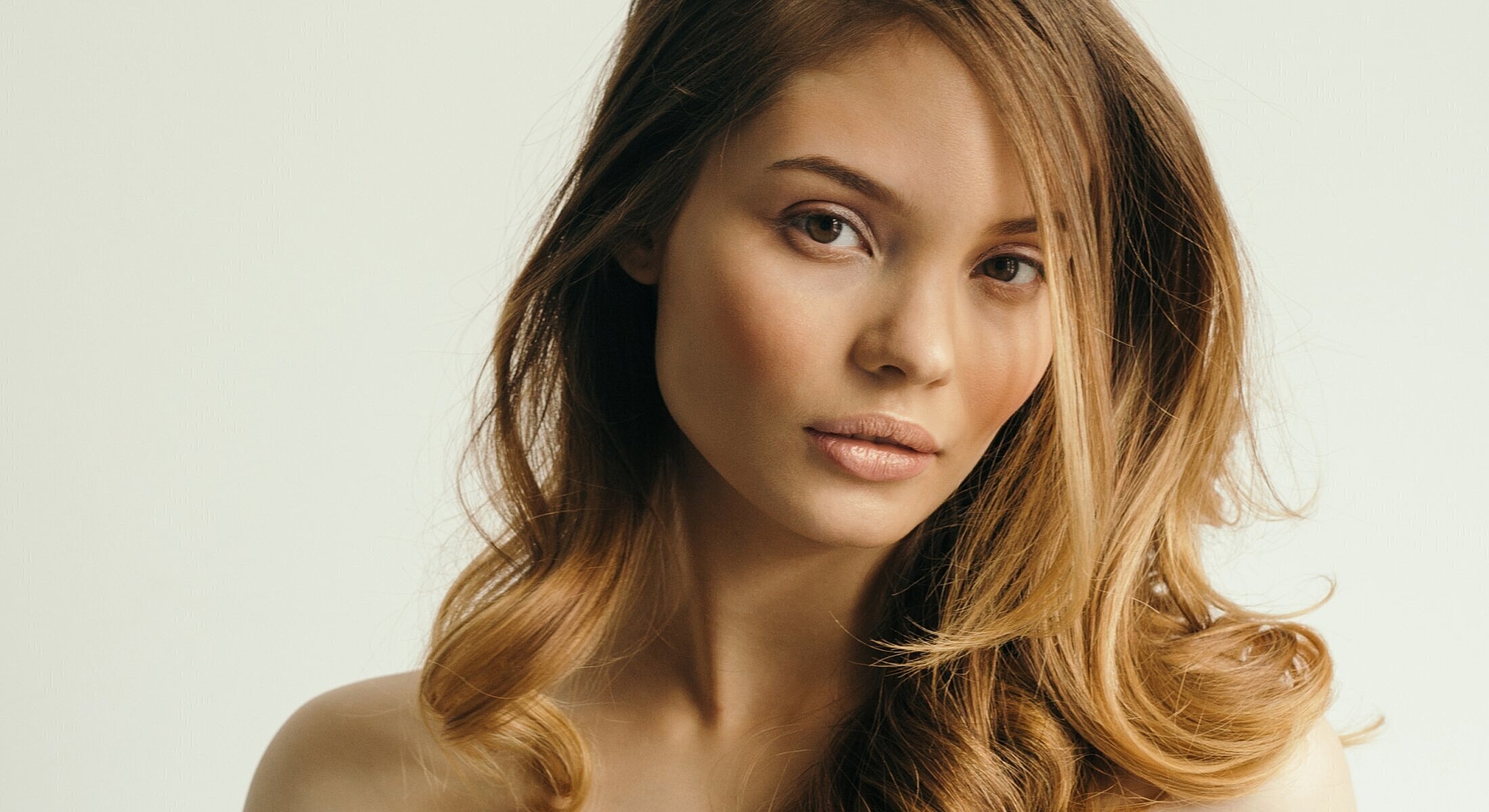 Portrait of a woman with wavy hair.