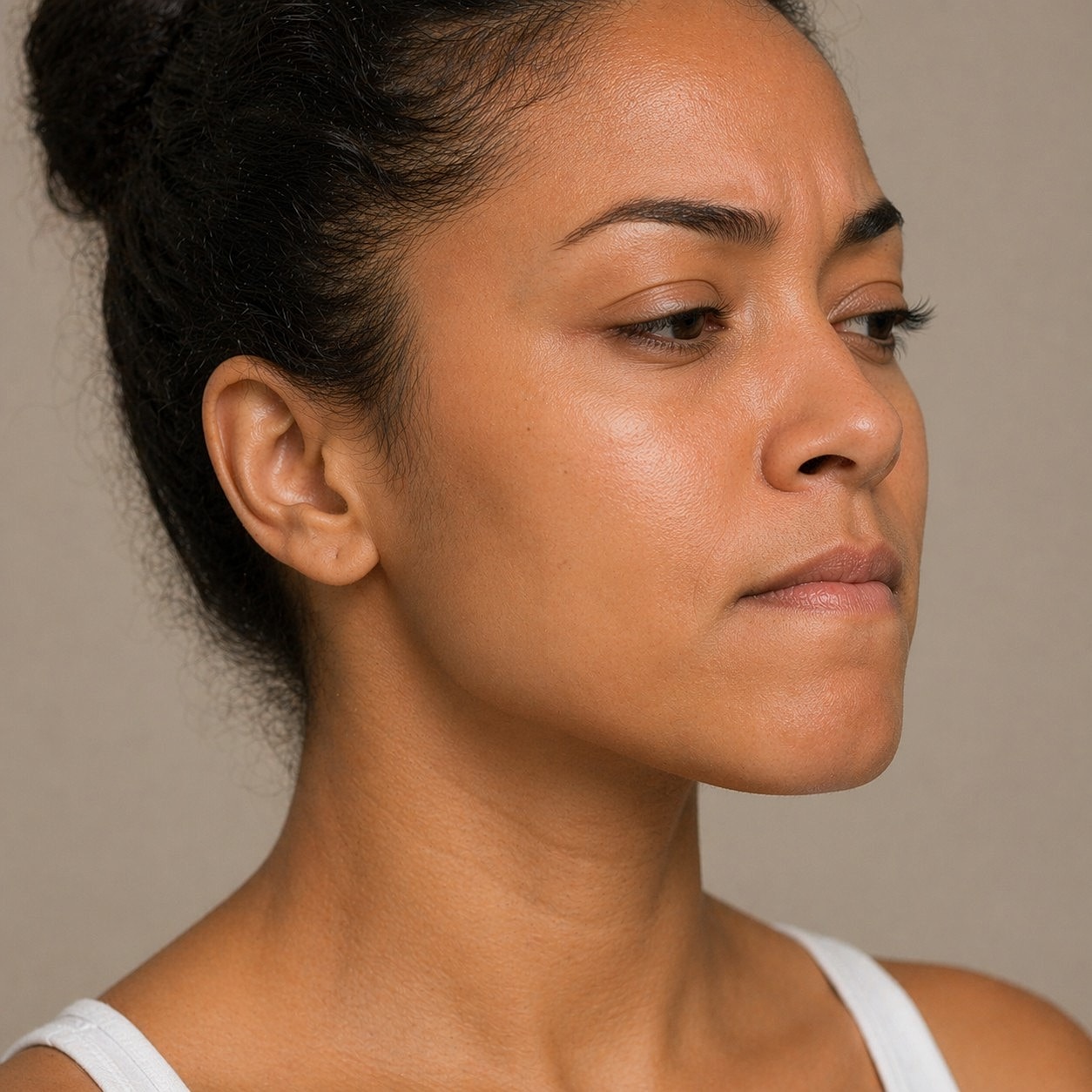 Woman with serious expression, side profile view.